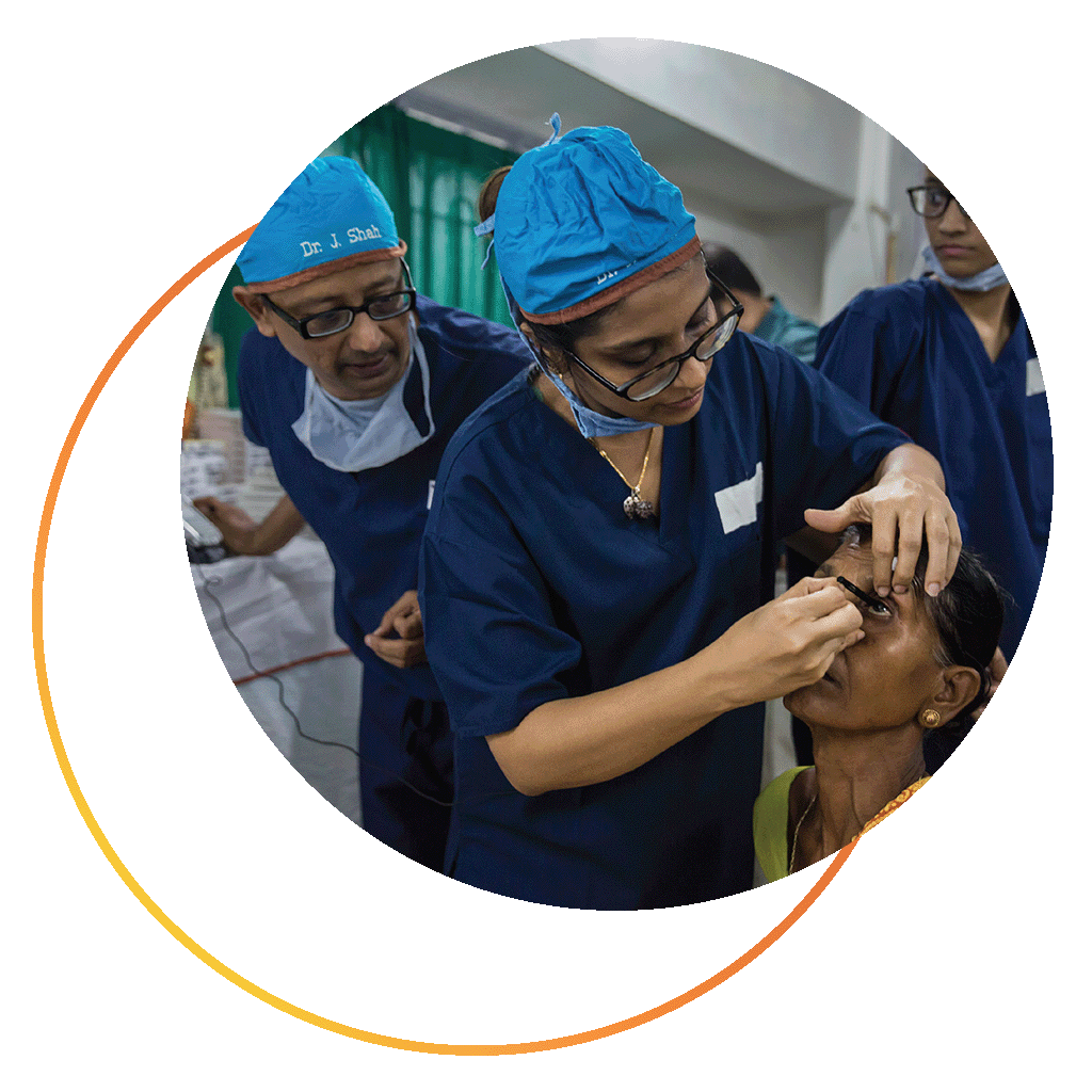 Volunteer ophthalmologists checking a patient's eye