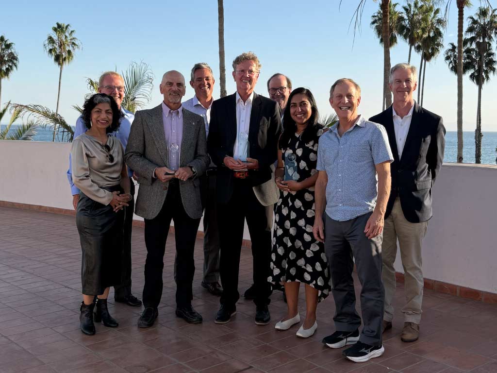 Recipients smiling with board and staff.