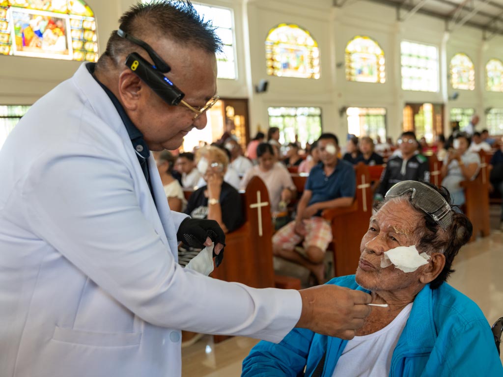 Patient having eye patches removed.