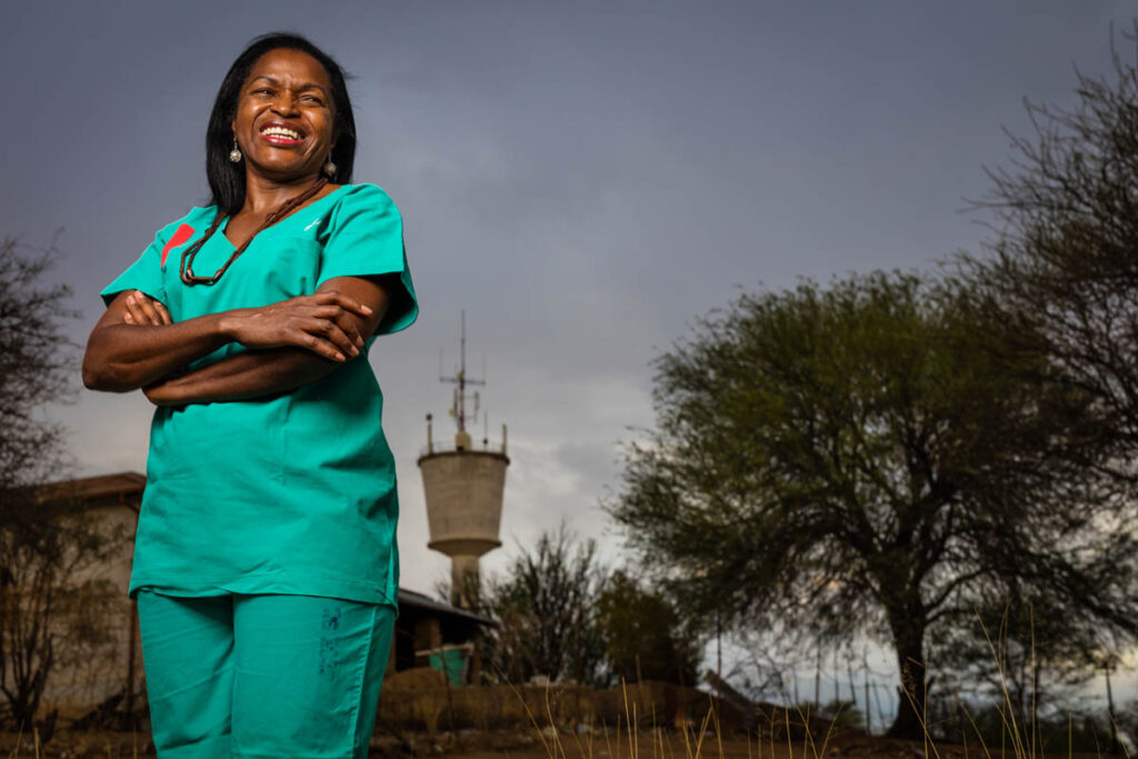 OMARURU, NAMIBIA, 5 November 2015: Dr Helena Ndume, 54, winner of the Mandela prize and Namibia's most celebrated opthmalogist and a genuine surgeon to the people. Ndume grew up in political exile and studied in East Germany and after the wall came down did her specialisation in West Germany. She has spend many years in government hospitals and performed thousands of eye surgeries, the vast majority of which were for the poorest demographic in Namibia. She is seen outside the remains of the first hospital in Omaruru, where she is currently holding a blindness clinic for people from all over Western Namibia. (Photo by Brent Stirton/Reportage for National Geographic Magazine.)