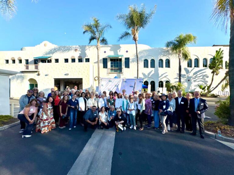 Group smiling at SEE headquarters