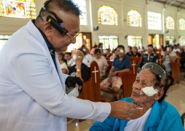 Patient having eye patches removed.