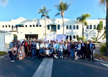 Group smiling at SEE headquarters